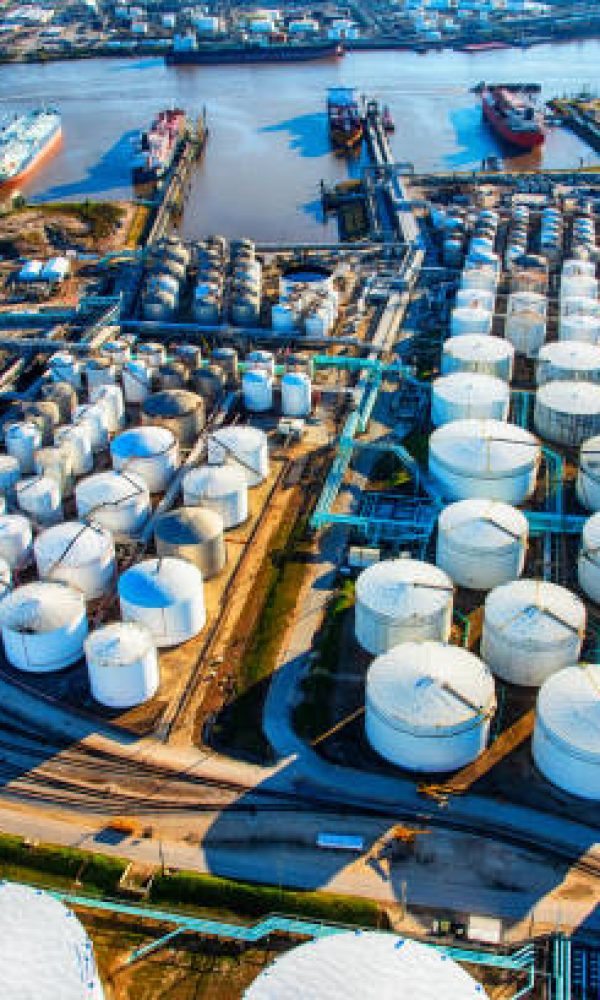 A group of large sea baring oil tankers moored at a Texas oil refinery near Trinity Bay just outside of Houston, Texas, loading oil for export throughout the world.